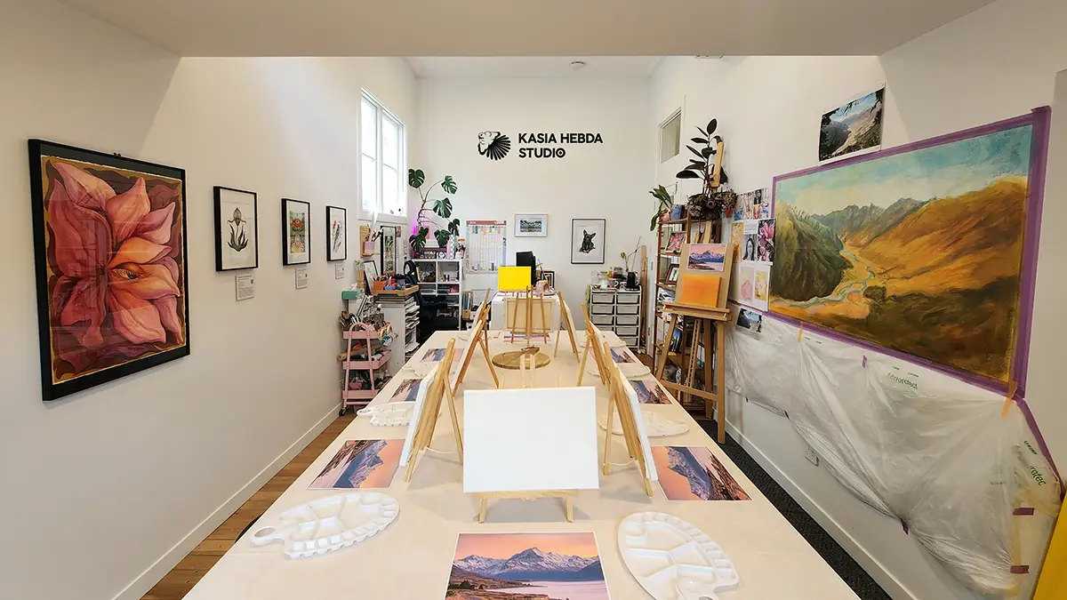 The studio set up for an after school art class at Kasia Hebda Studio, Queenstown, with paint palettes laid out along the tables