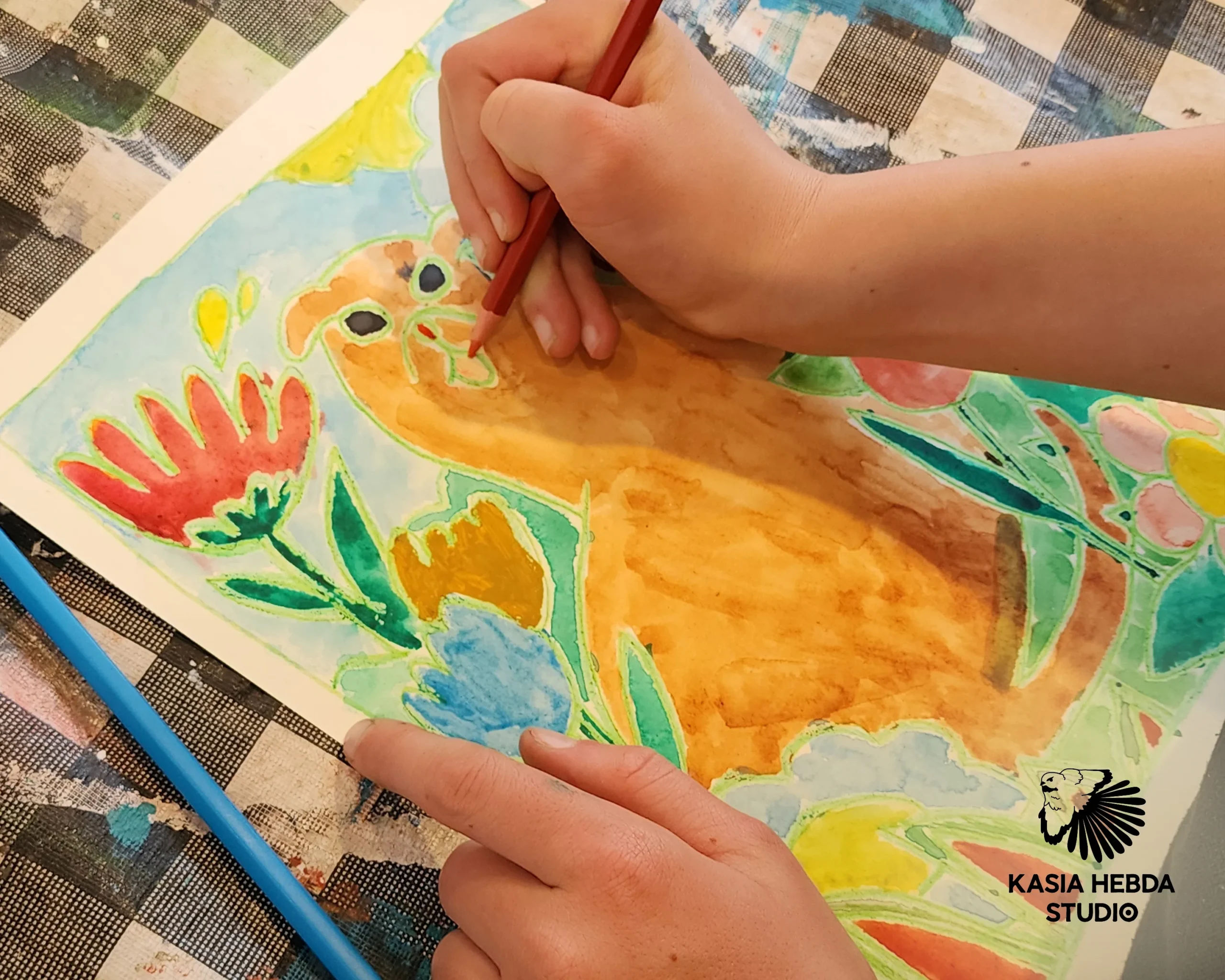 A student painting a bright watercolour garden scene