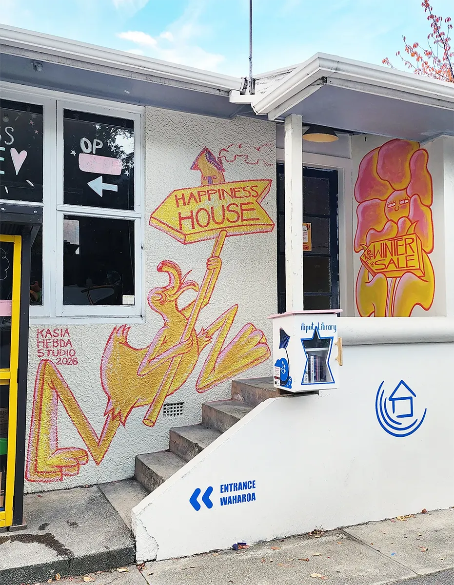 Happiness House on Park Street with a hand-painted mural around the entrance