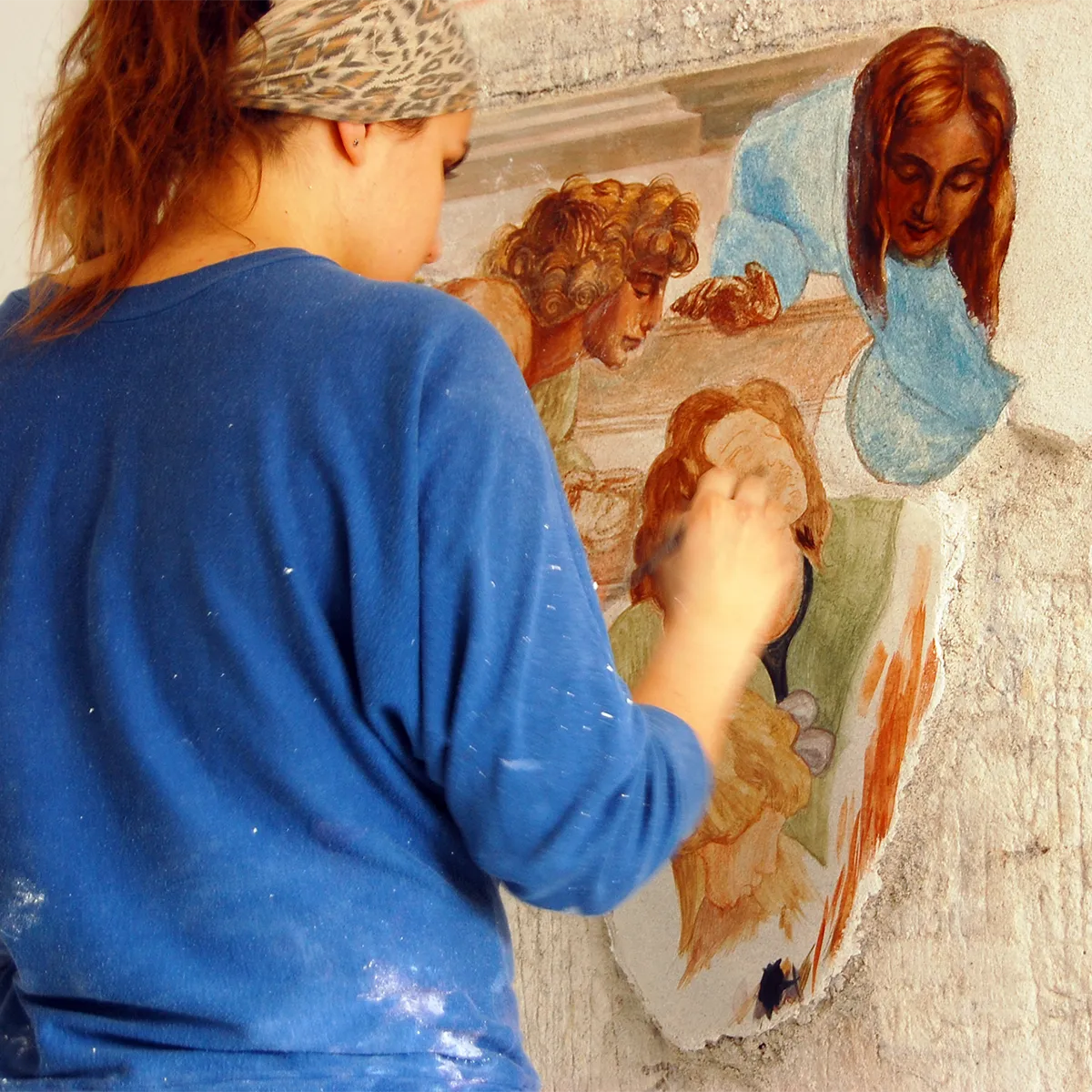 Kasia Hebda at work on a fresco wall painting