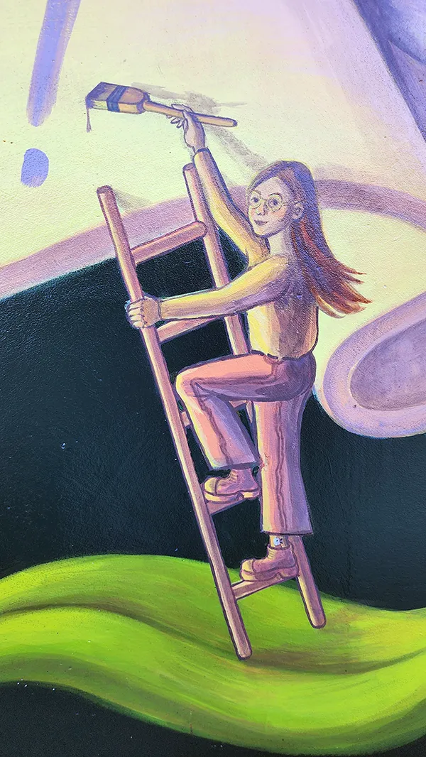 Detail - a small painted figure climbing a ladder with a paintbrush in the Onwards in Art! mural